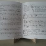 five-note book on easel